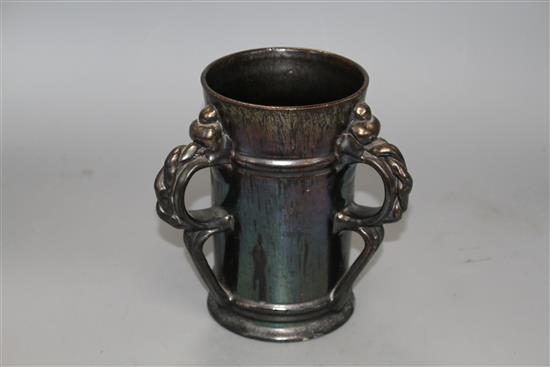 A Dickerware black lustre three handed tyg, early 20th century, indistinct impressed mark, height 18.5cm